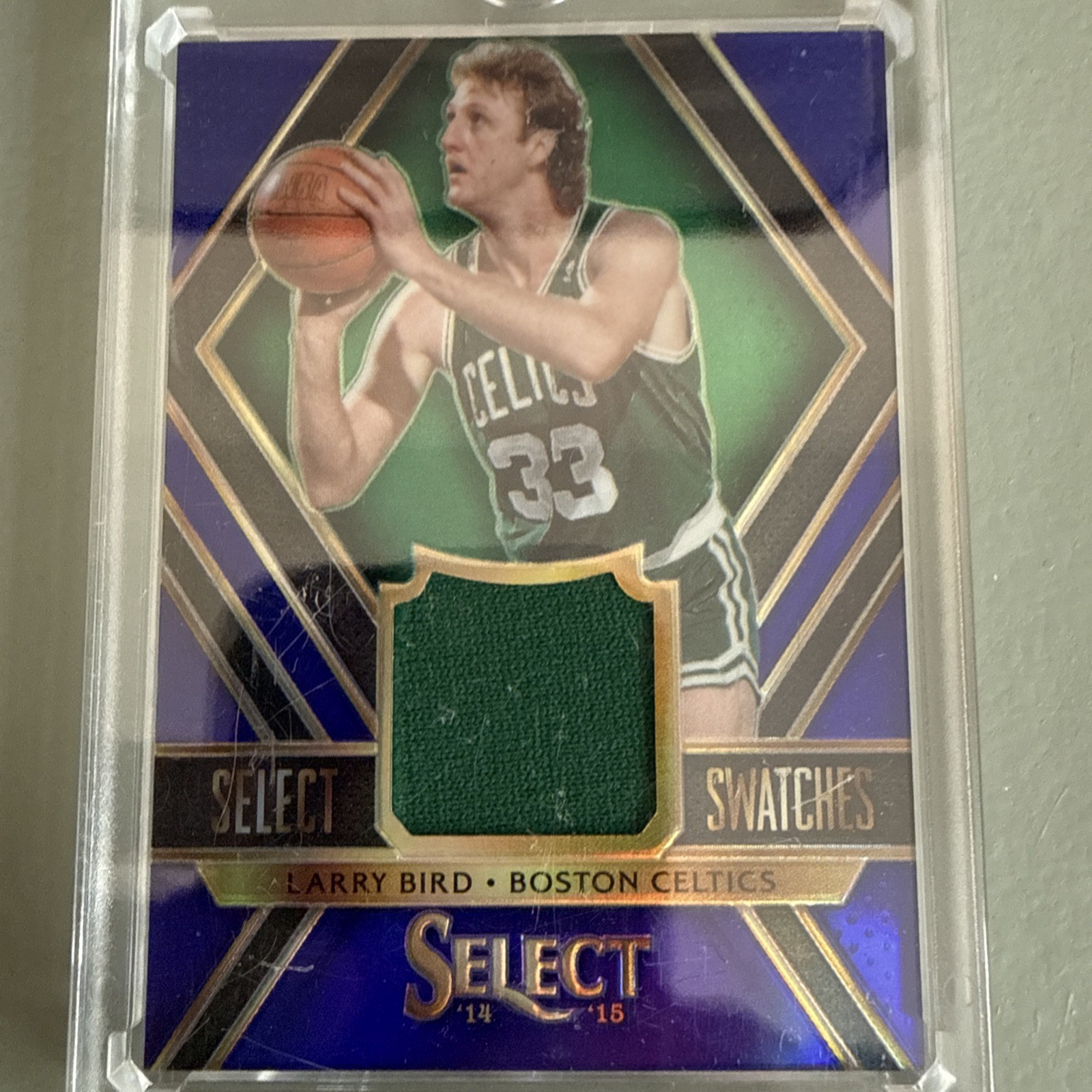 2014-15 Panini Select – Swatches Larry Bird #49 Purple Prizm /99 (MEM)